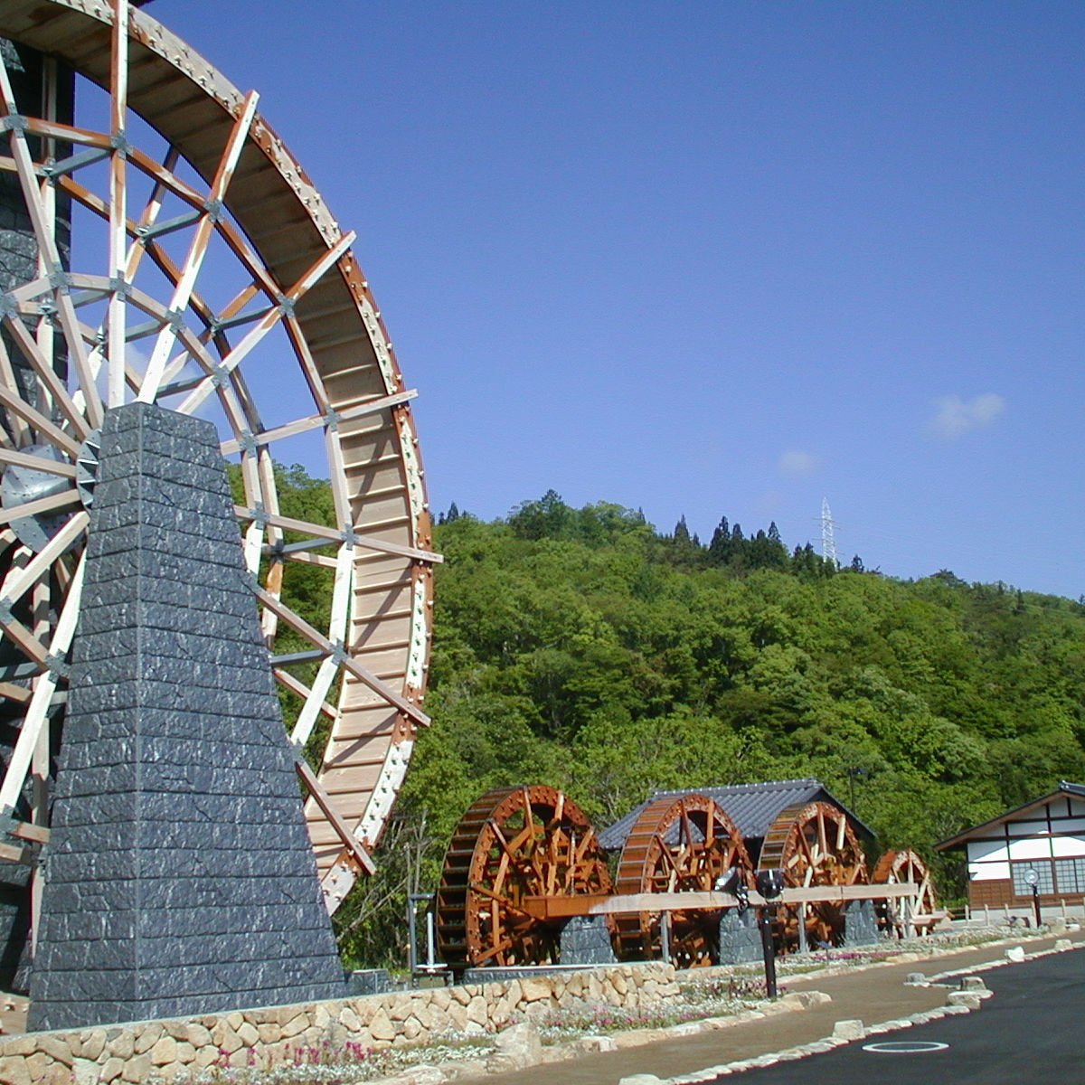 water wheel next to a building