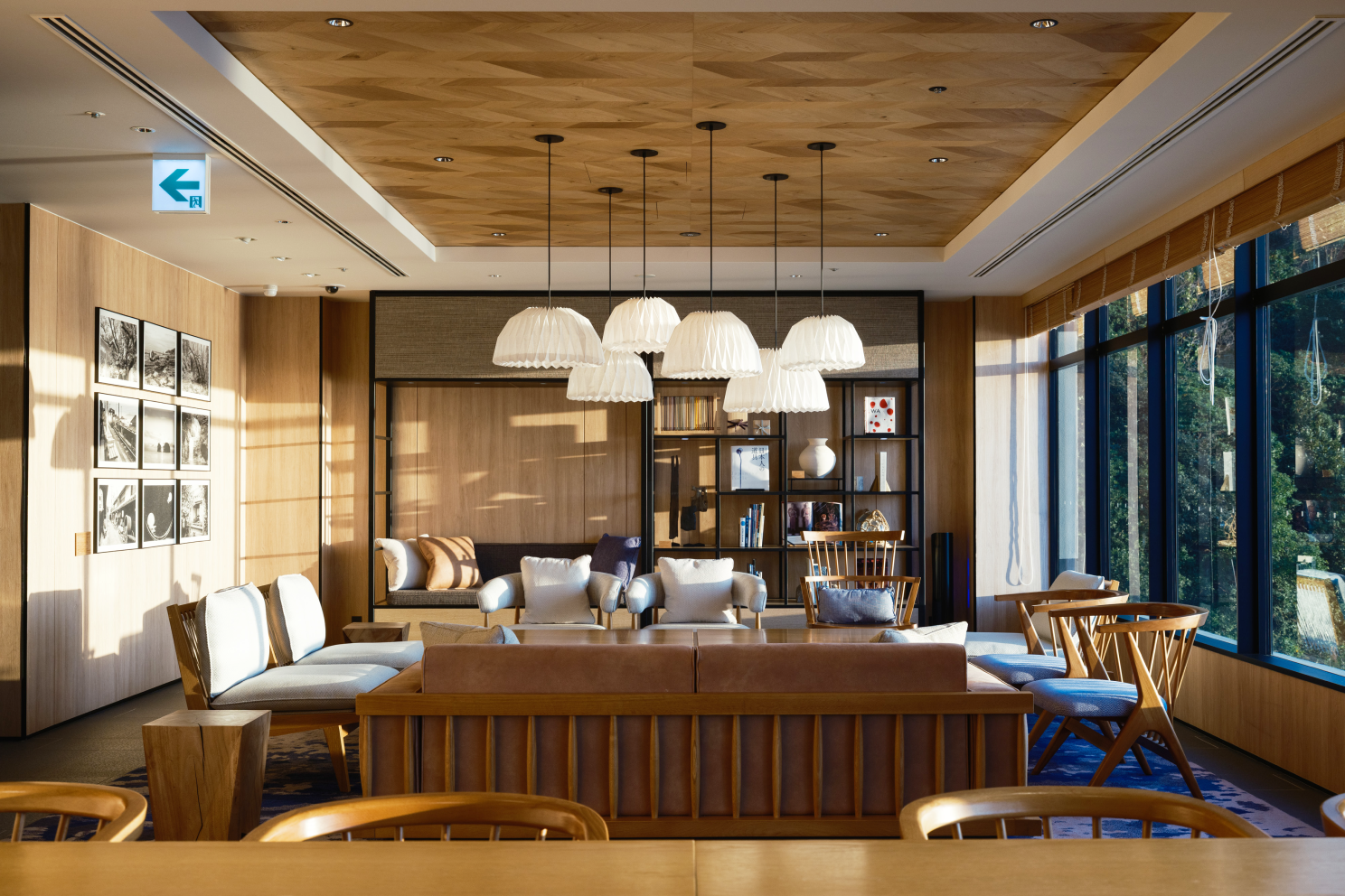 a room with a couch and chairs