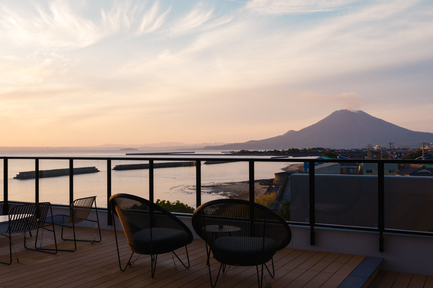 chairs on a deck overlooking a body of water