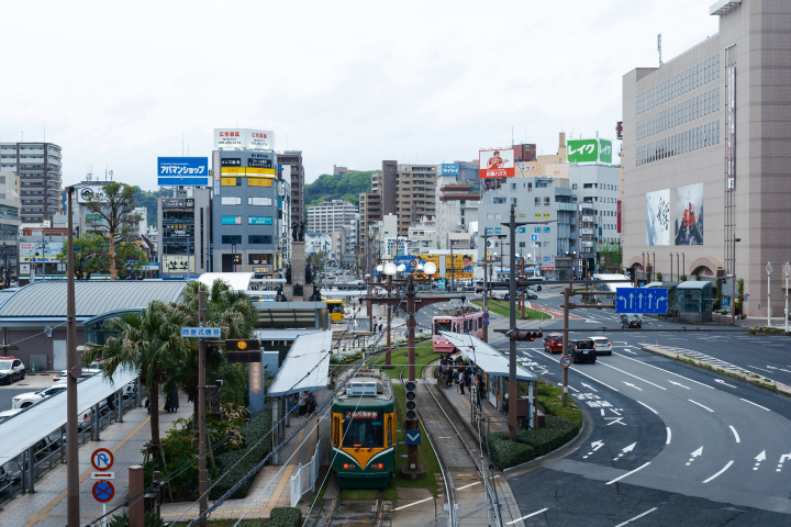 a train on tracks in a city