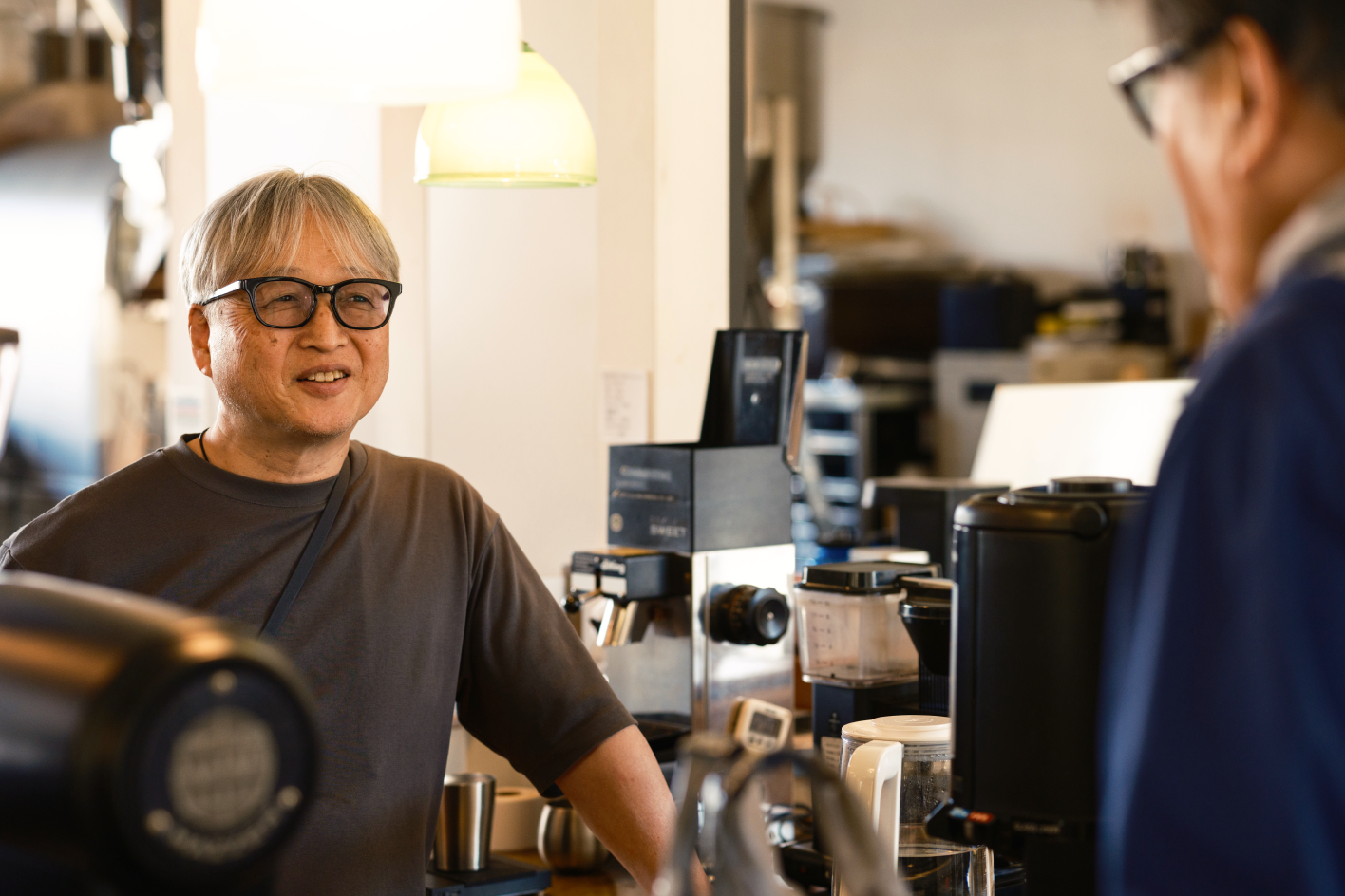 a man standing in a coffee shop