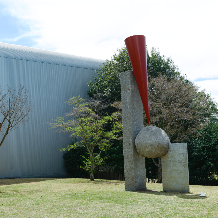 a sculpture in a grassy area