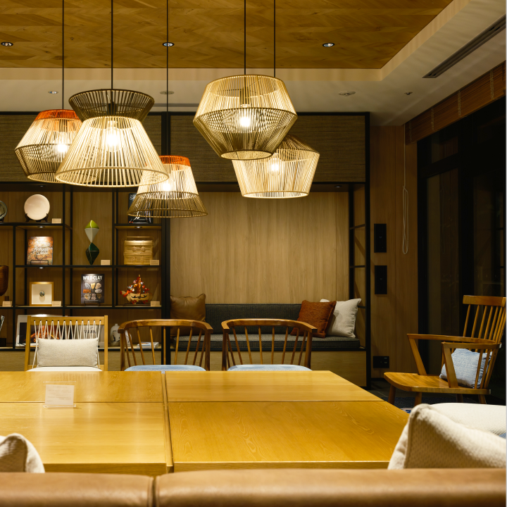 a room with a table and chairs and a table with a chandelier