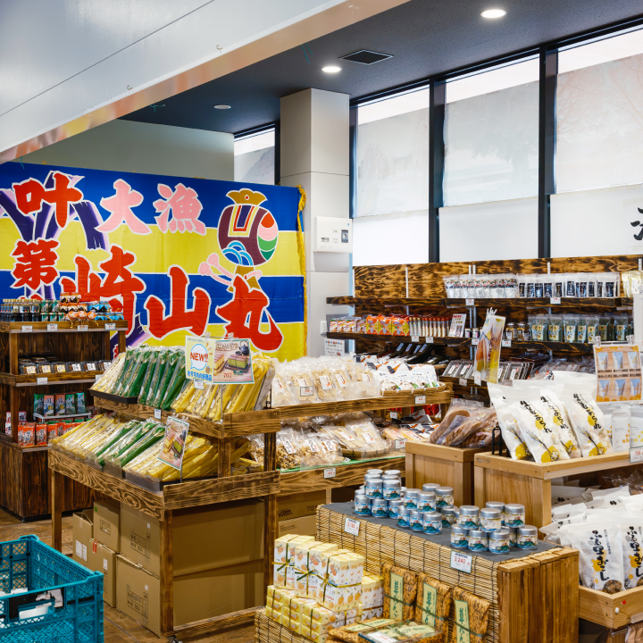 a store with shelves of food and a sign