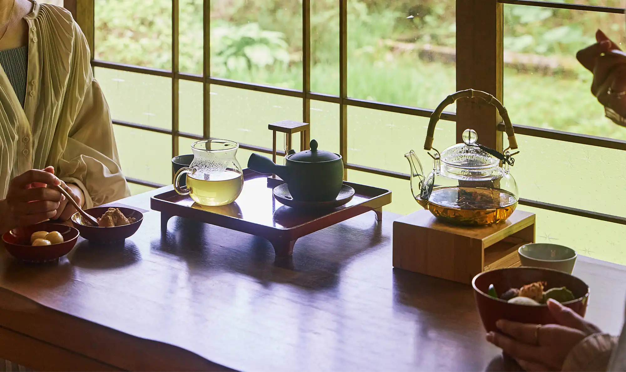 a table with teapots and cups on it
