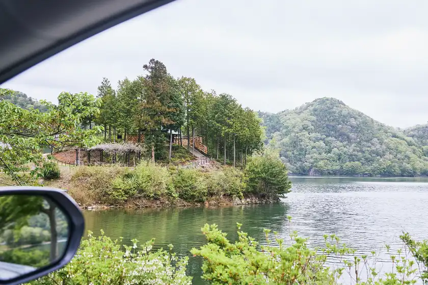 a view of a lake from a car window
