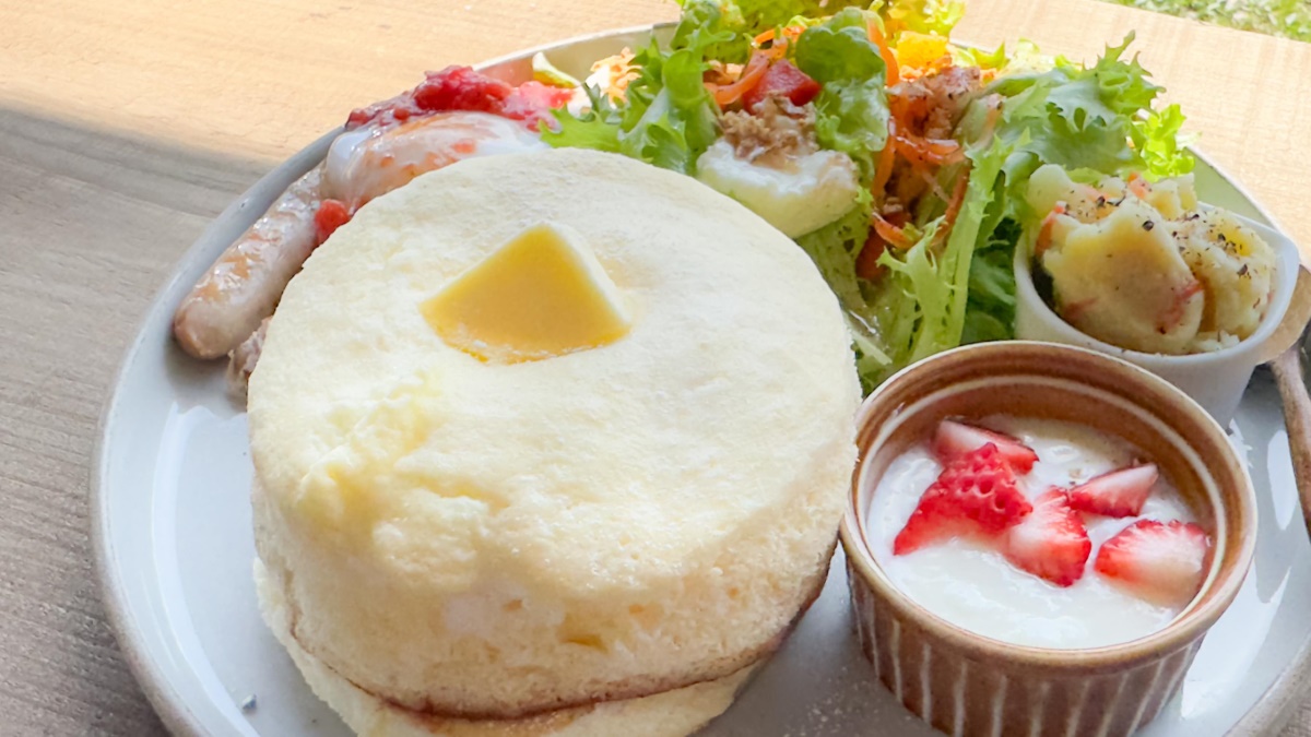 a plate of food with a side of salad