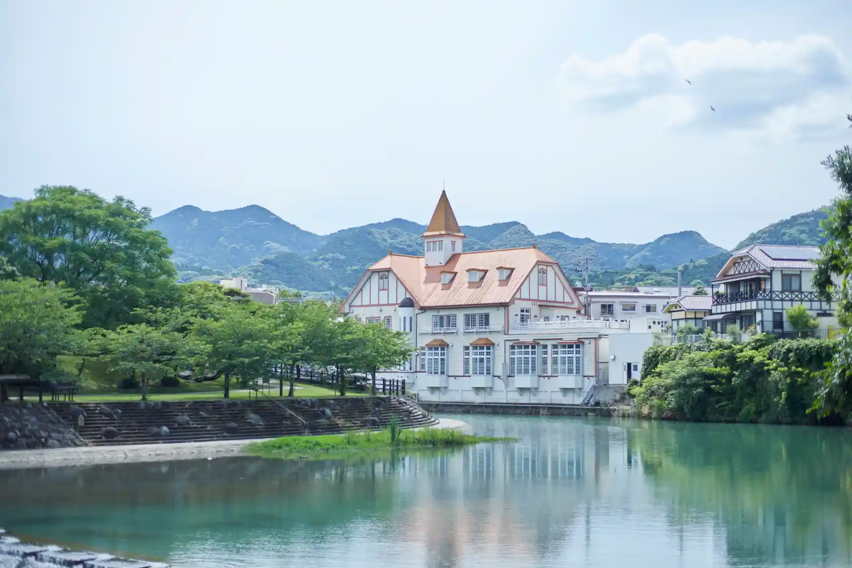 a building next to a body of water