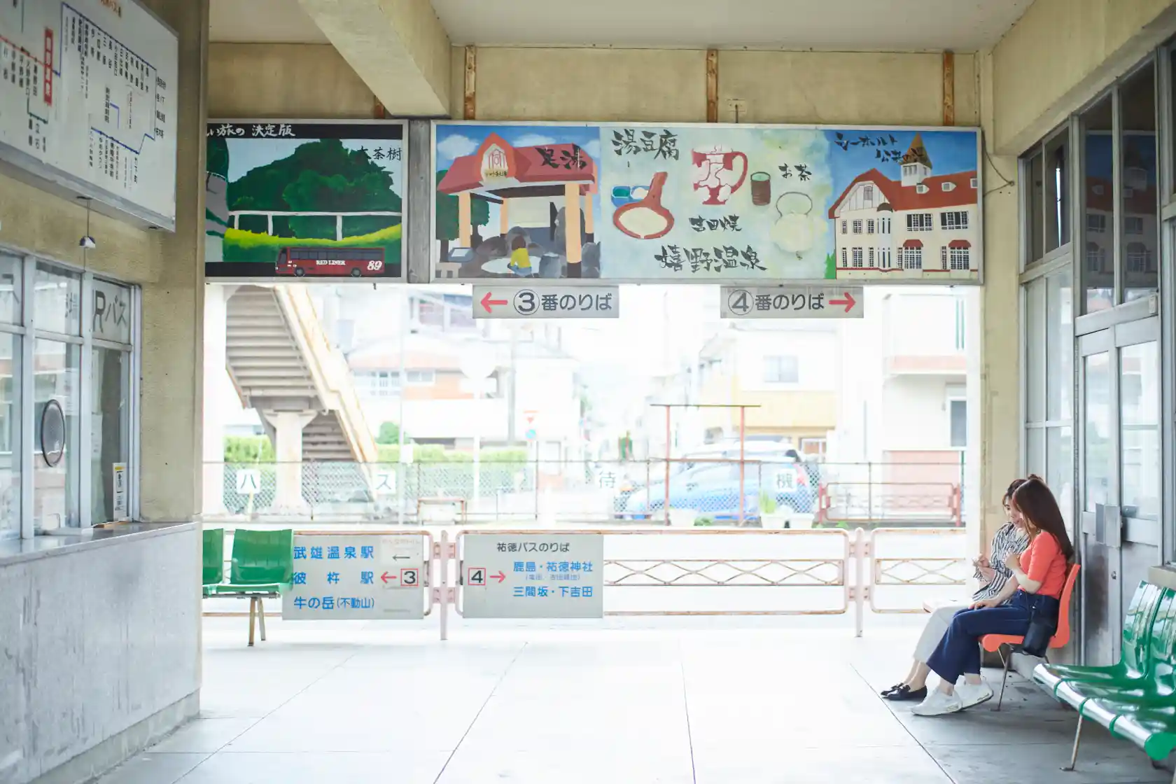 a woman sitting on a bench