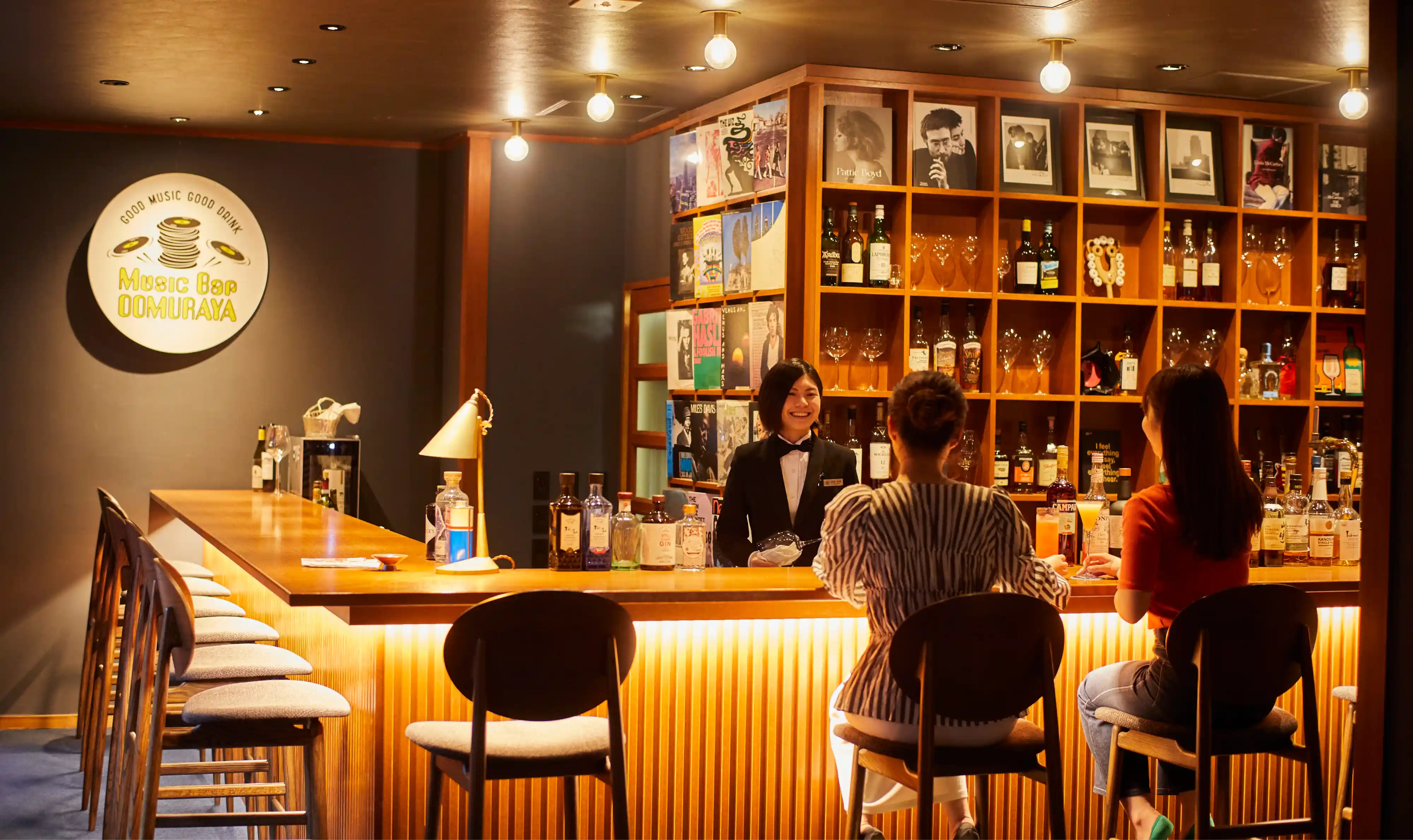 a woman standing at a bar counter