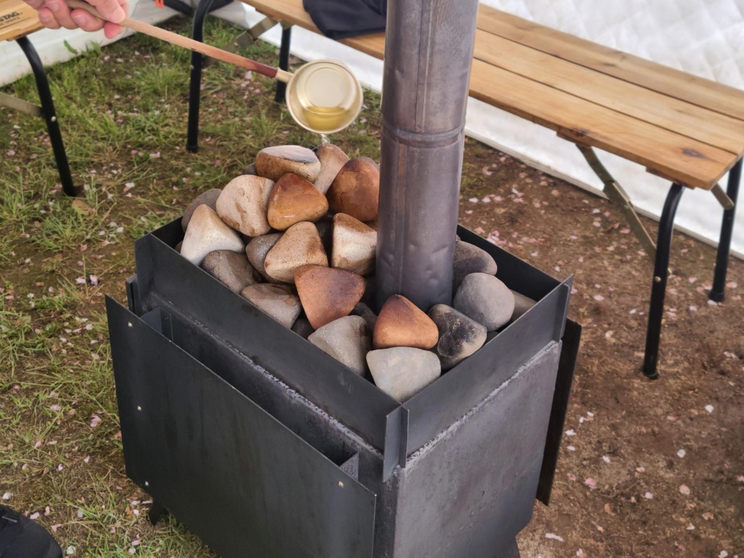 a metal box with rocks and a pipe