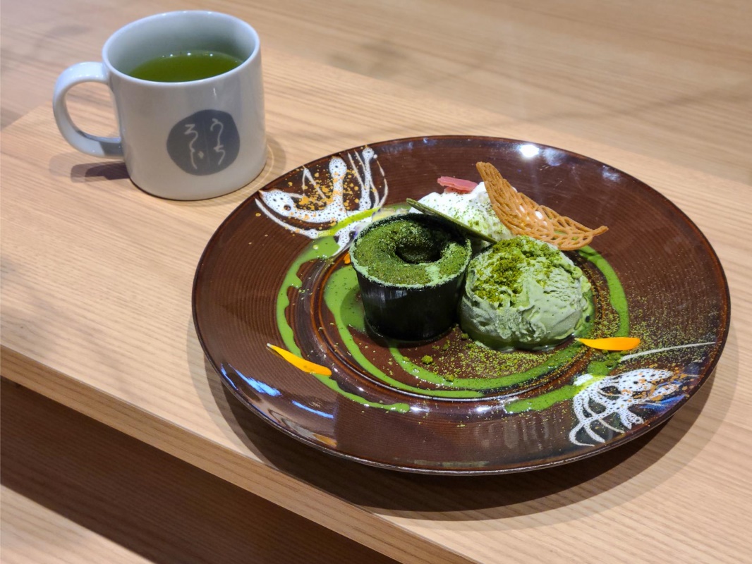 a plate of food and a cup of tea