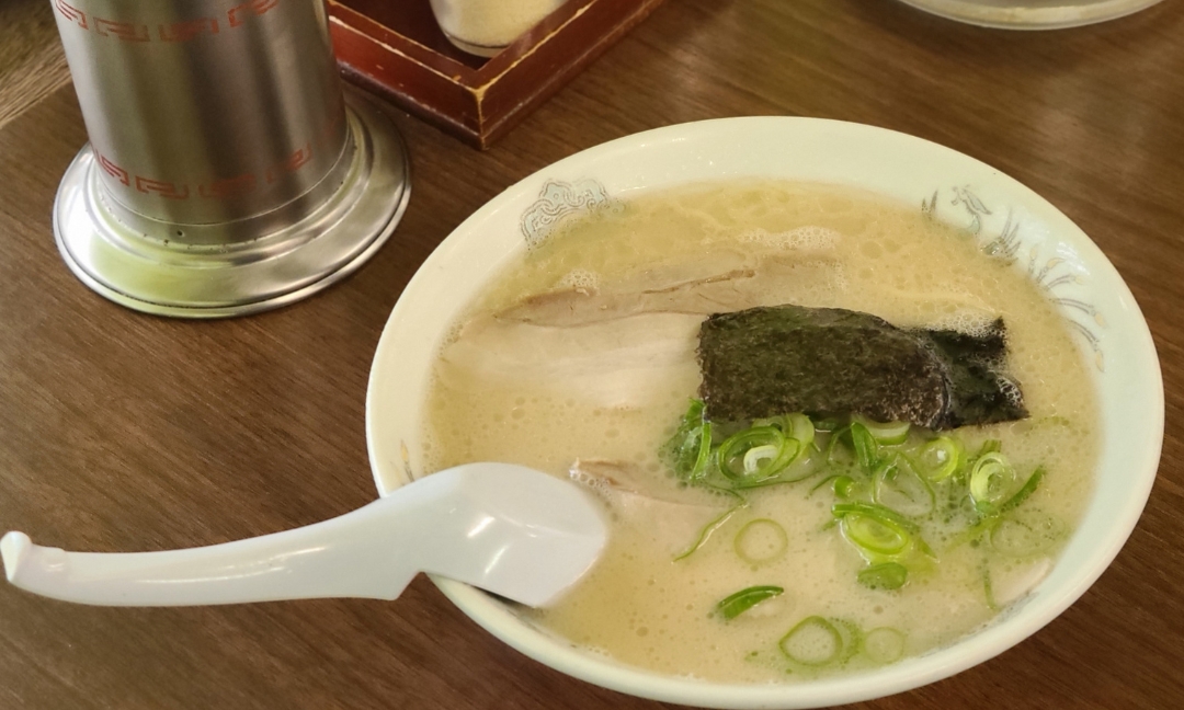 a bowl of soup with a spoon