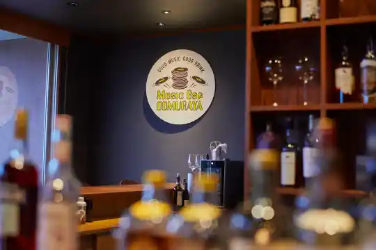 a bar with bottles of wine