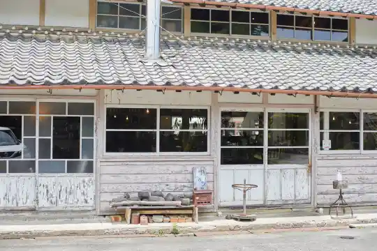 a building with windows and a bench