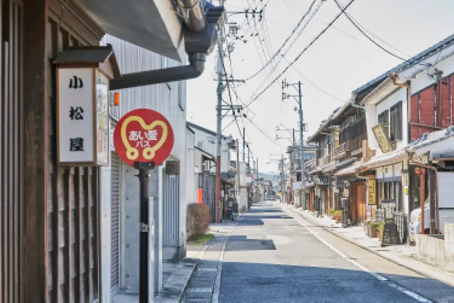 a street with buildings and signs