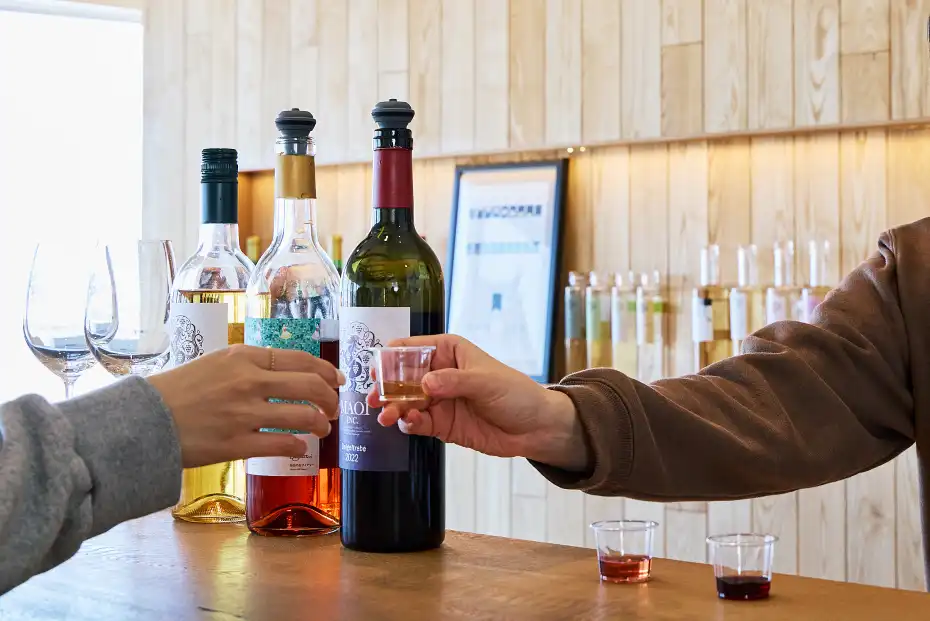 a person holding a shot of alcohol