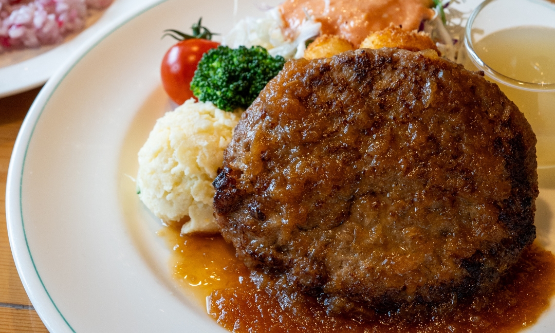 a plate of food with meat and vegetables