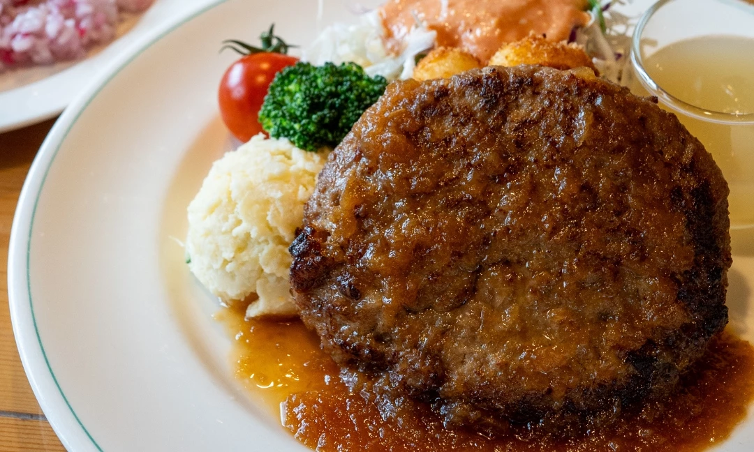 a plate of food with meat and vegetables