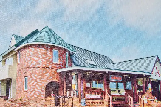 a brick building with a blue sky