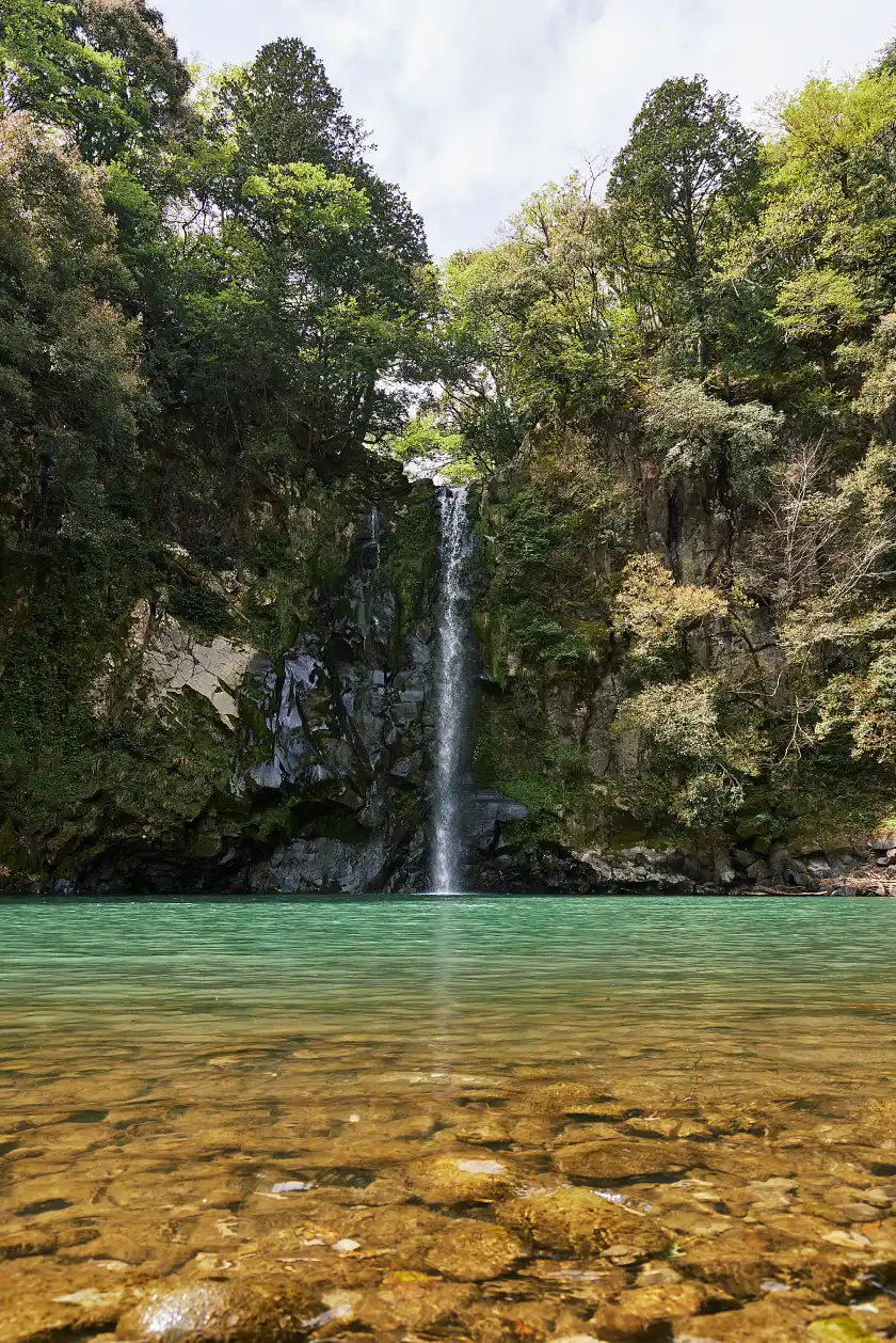 a waterfall in a body of water