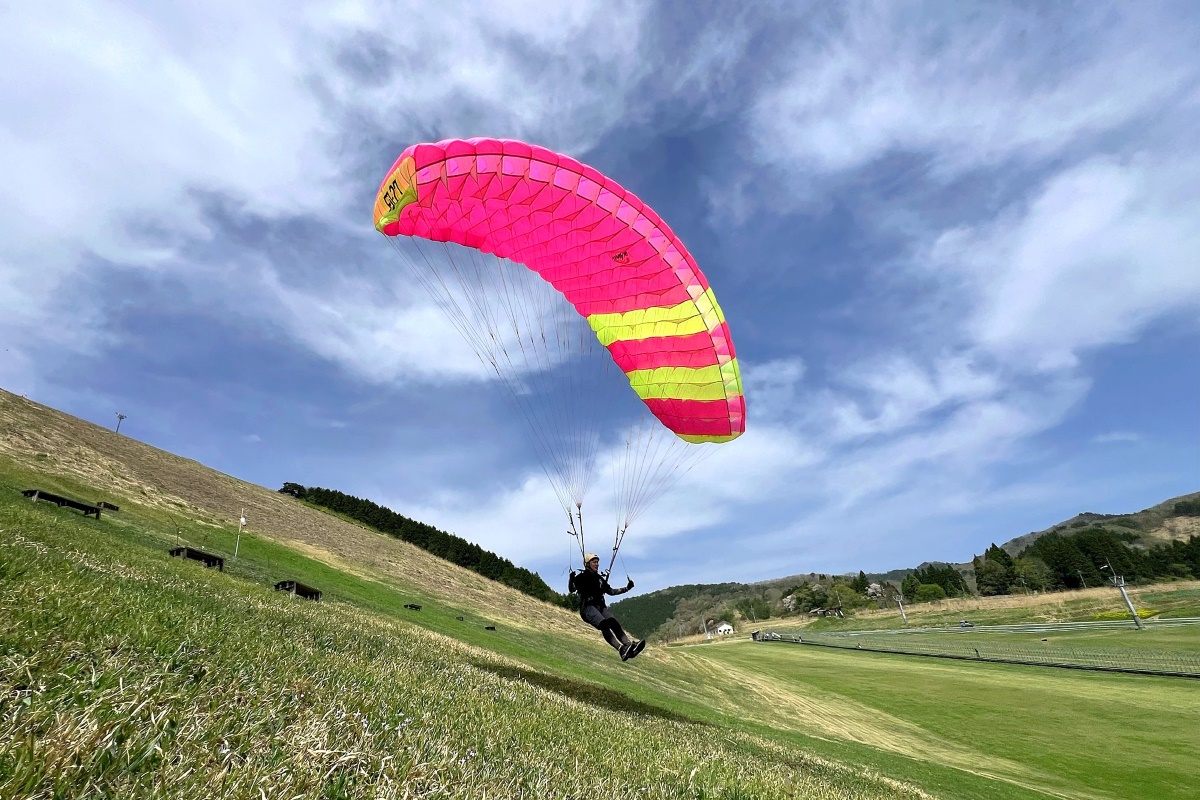 a person parachuting in the sky
