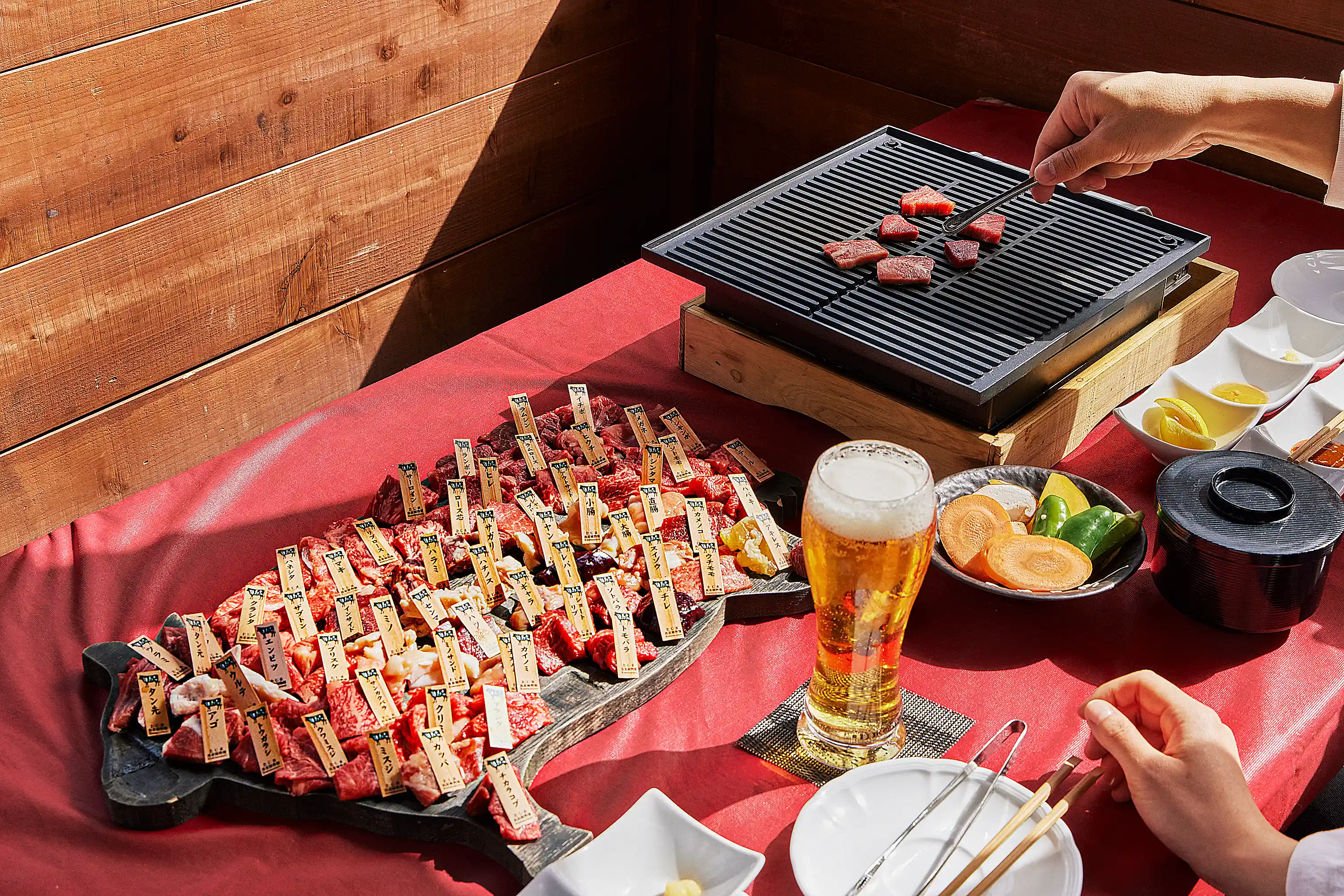 a table with food and a beer