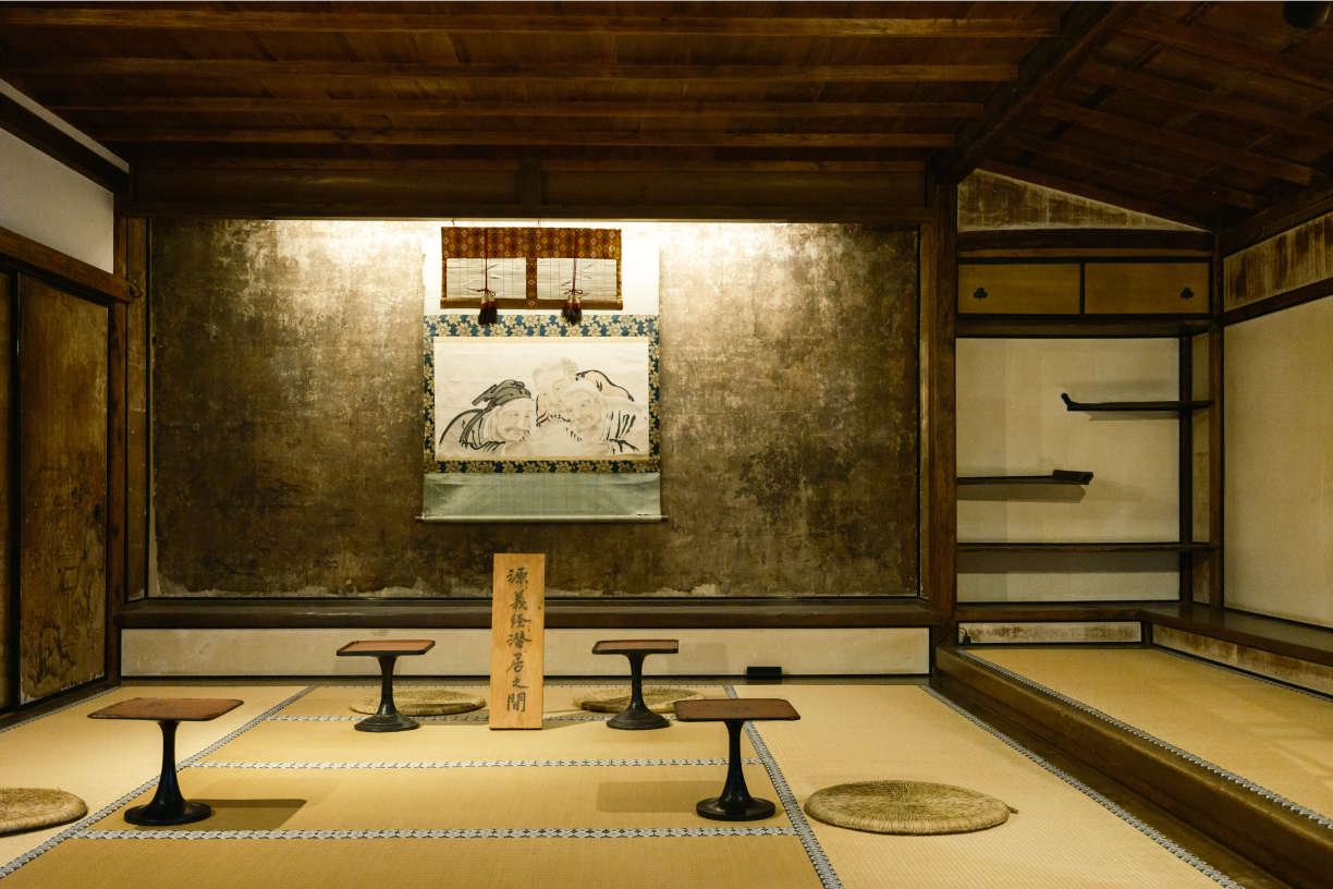 a room with a painting on the wall