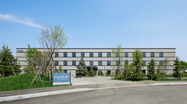 a building with trees in front of it