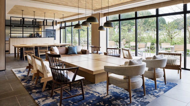 a room with a large table and chairs
