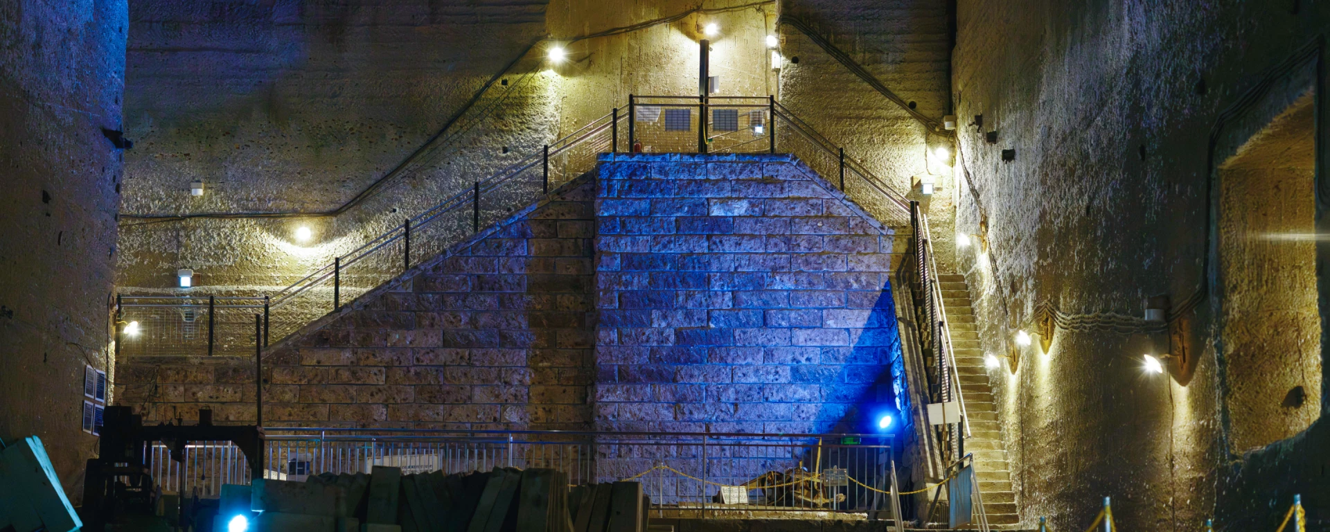a stone wall with a blue light