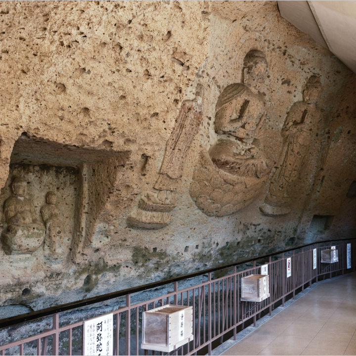 a stone wall with carvings on it