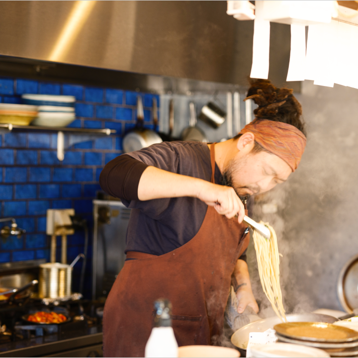 a man cooking in a kitchen