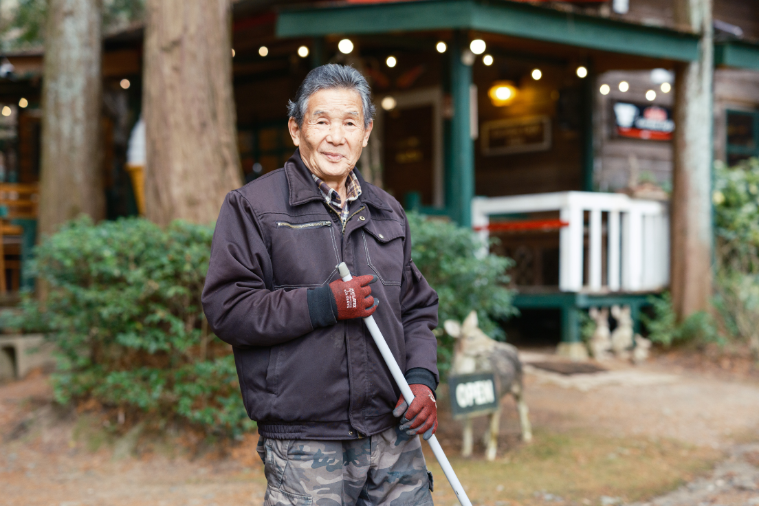 a man holding a broom