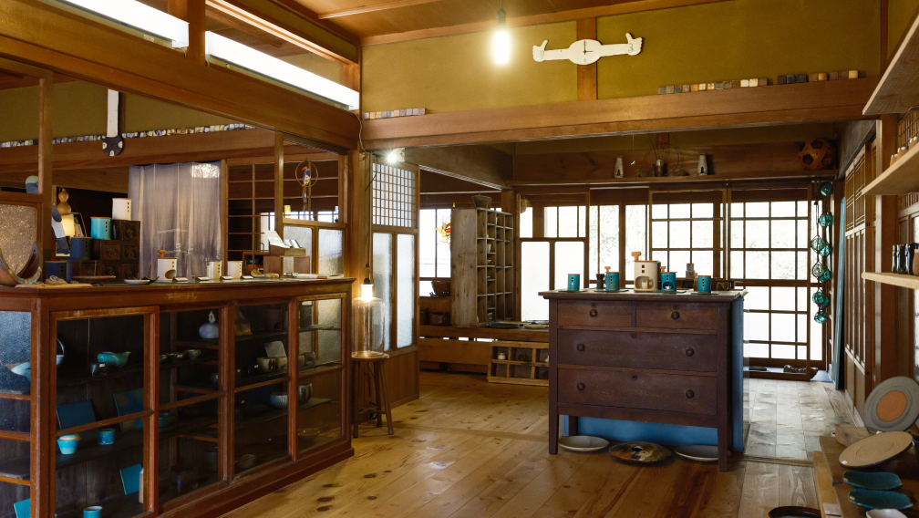 a room with wood floors and cabinets