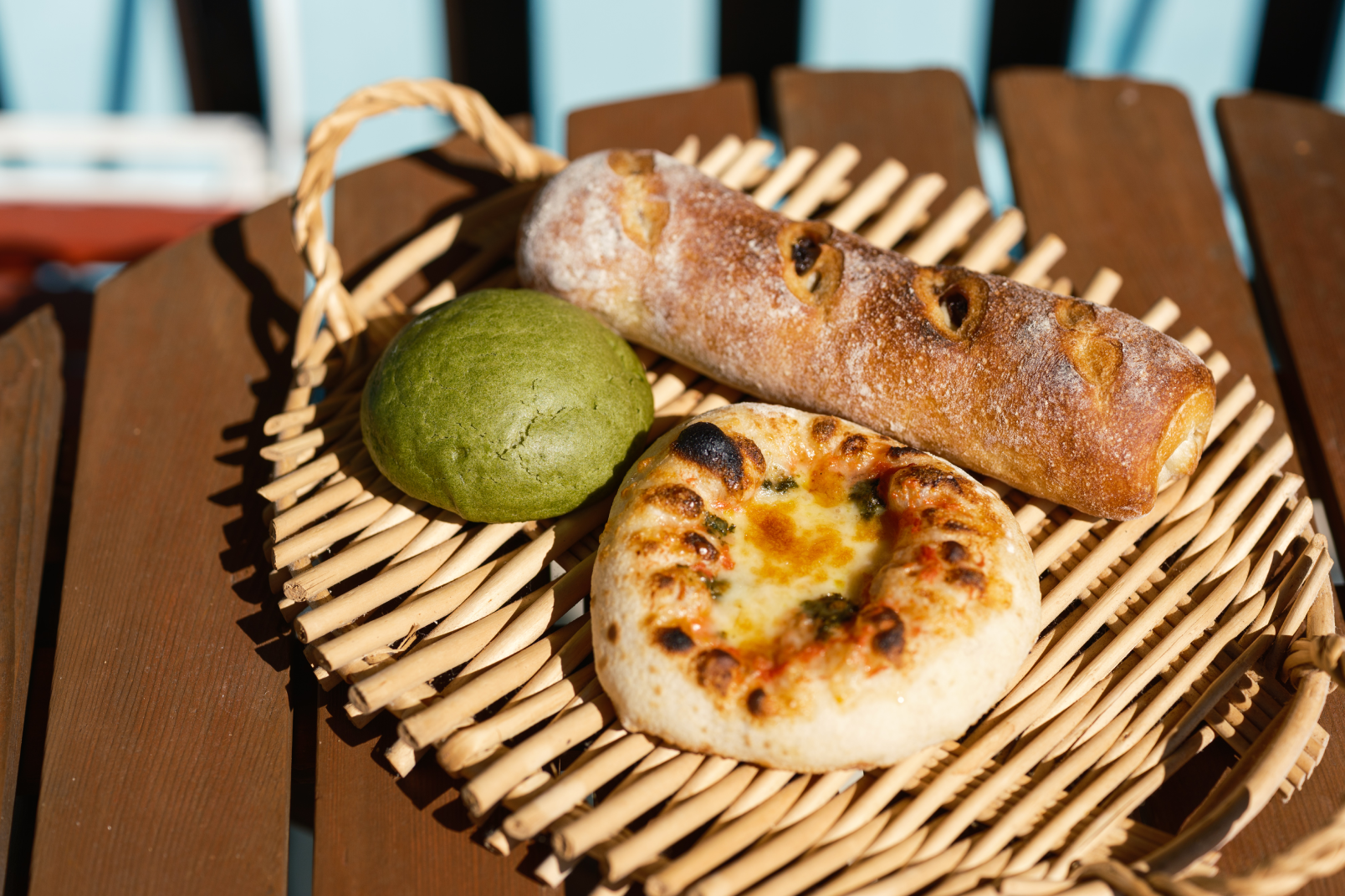 a bread and a loaf of bread on a wicker plate