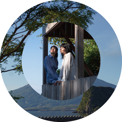 two women sitting on a wooden structure Japanese culture and traditions