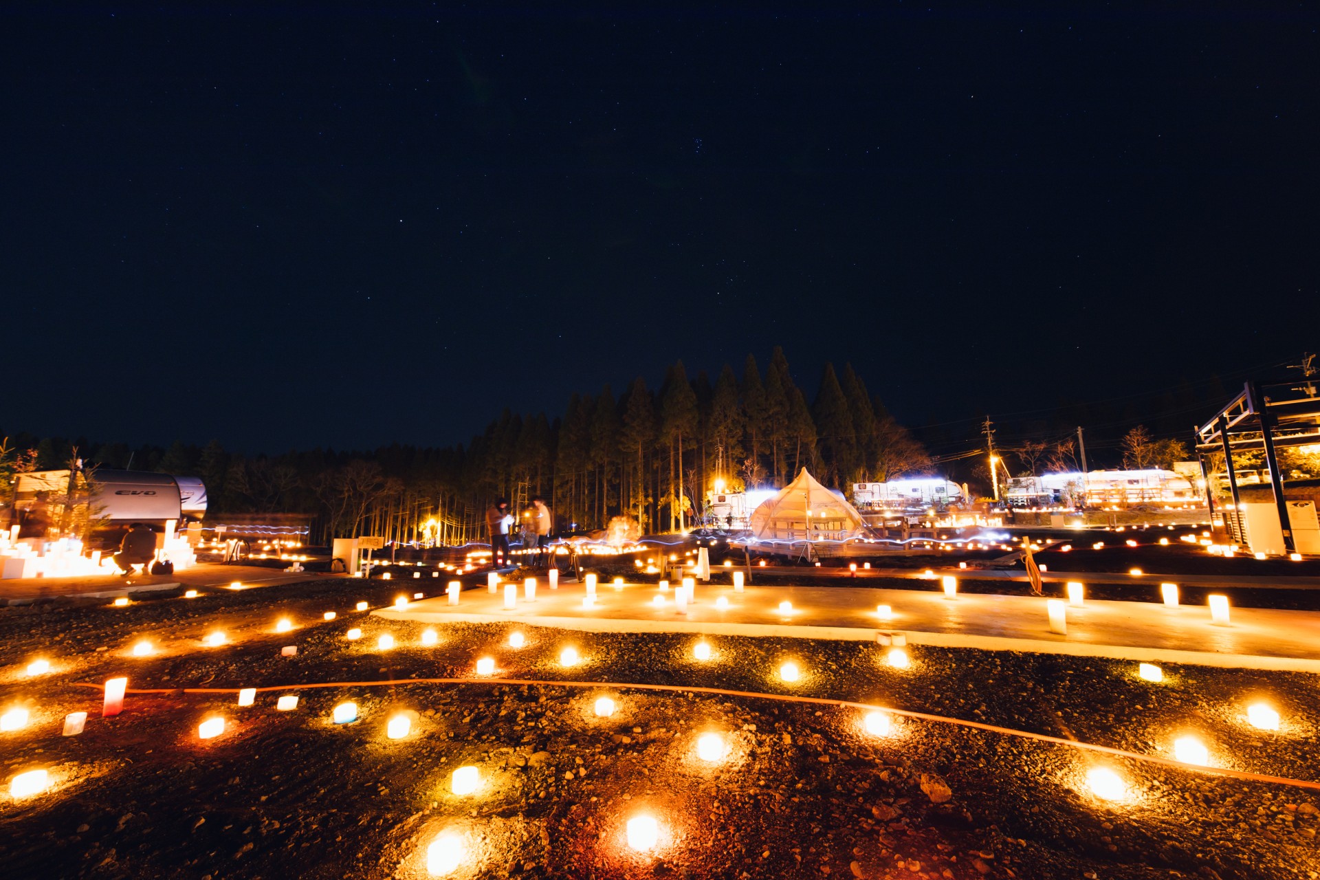 a lighted candles on a dirt road