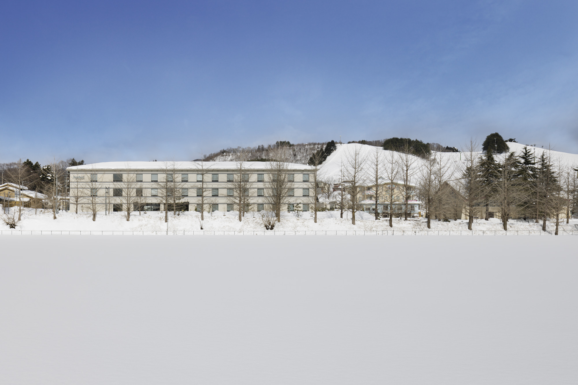 a building with snow on the ground