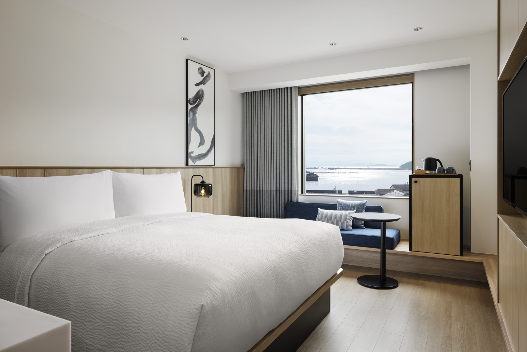 a room with a bed and a window