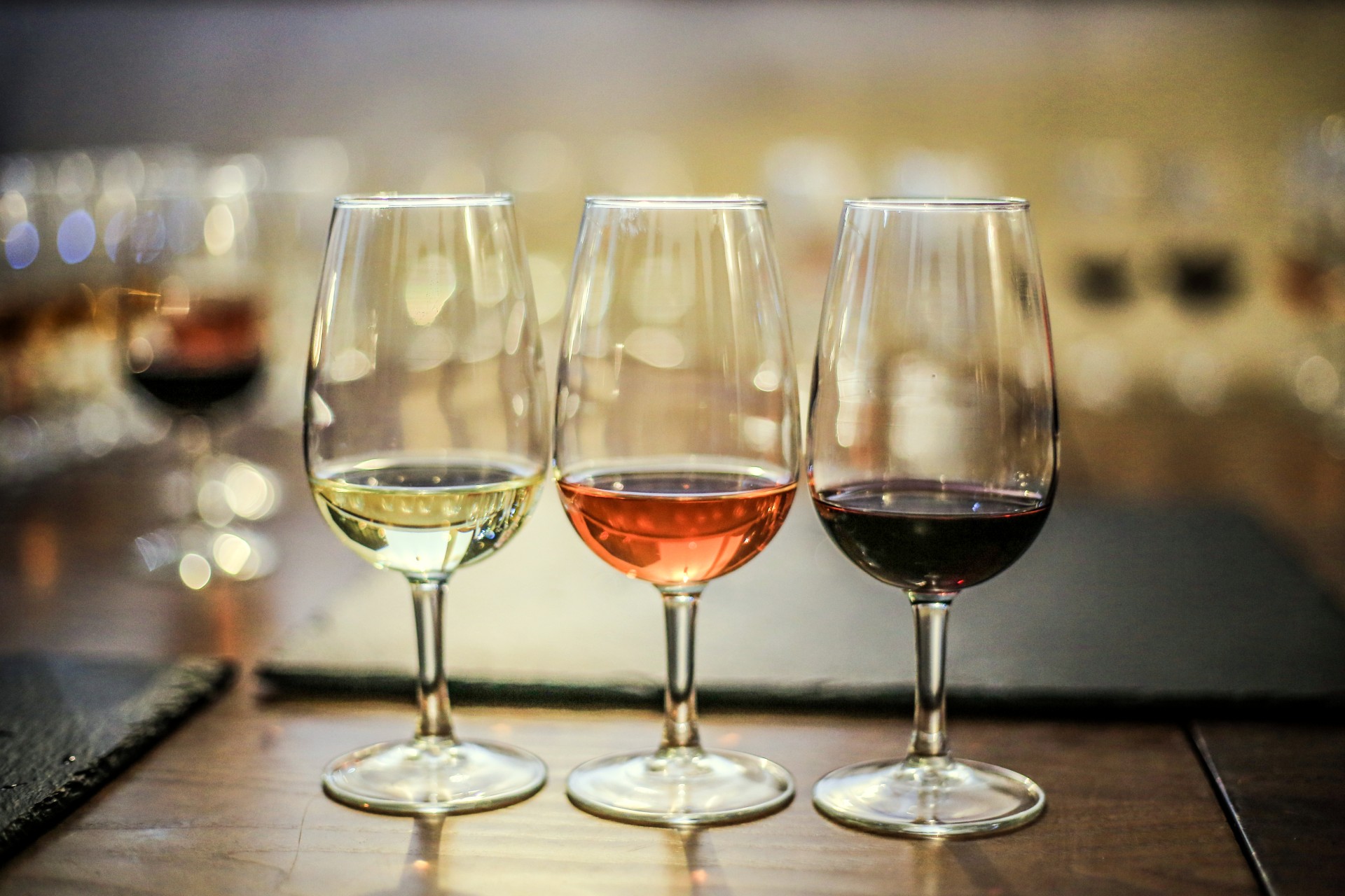 a group of wine glasses on a table