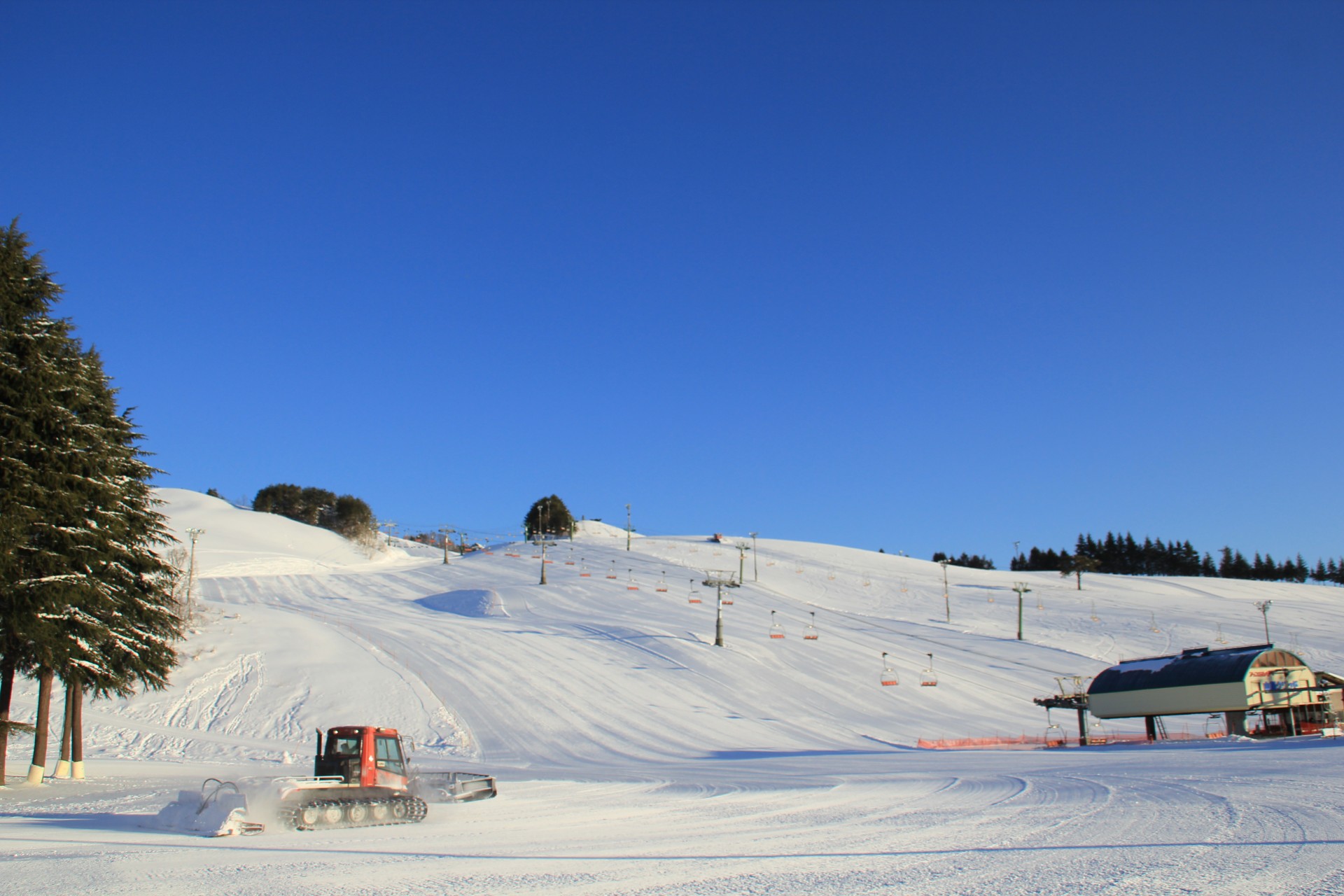 a snow plow on a mountain