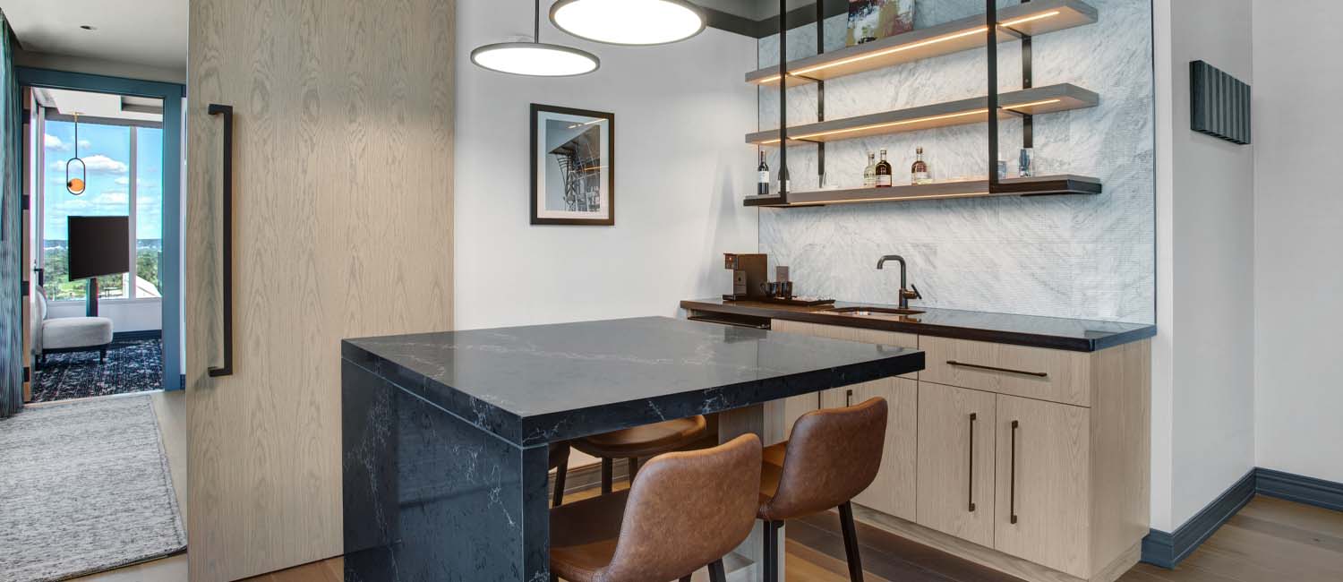 hotel room with black marble bar counter