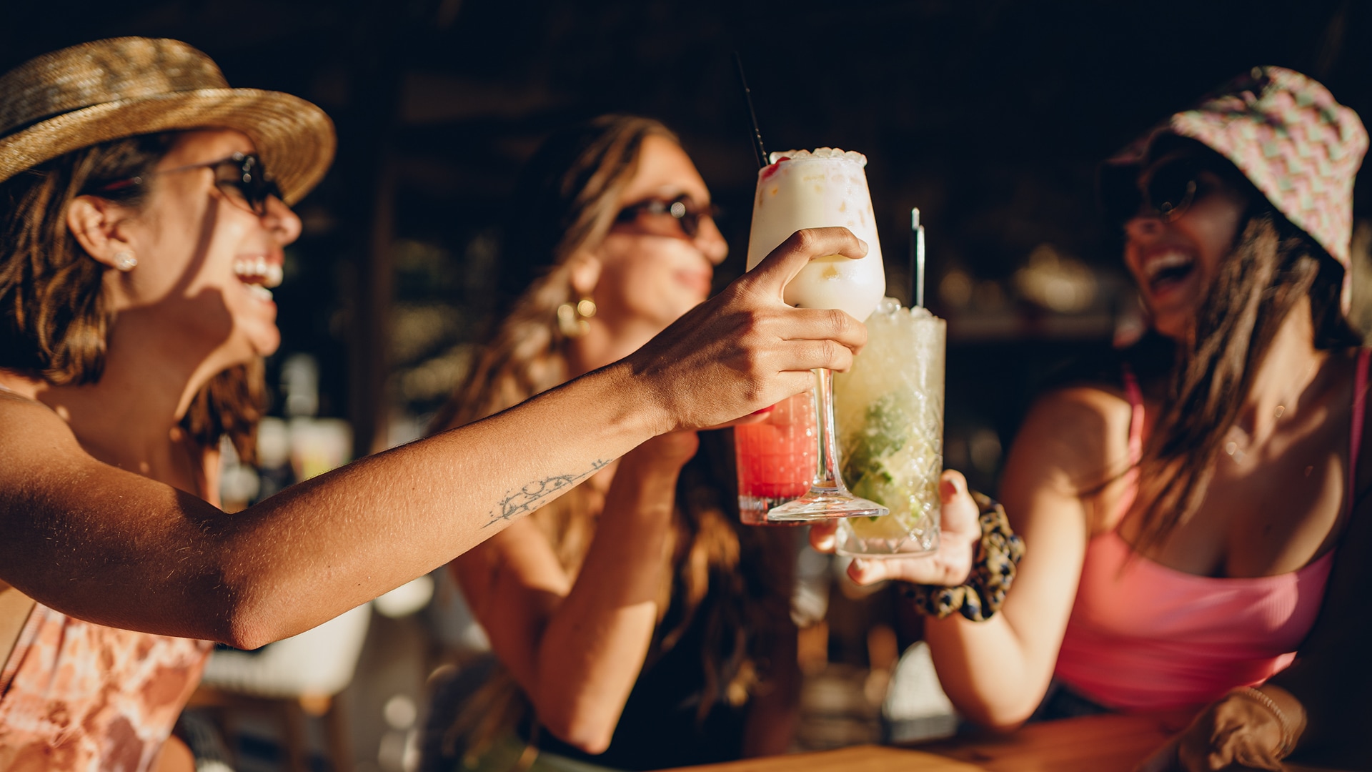 a group of people holding drinks