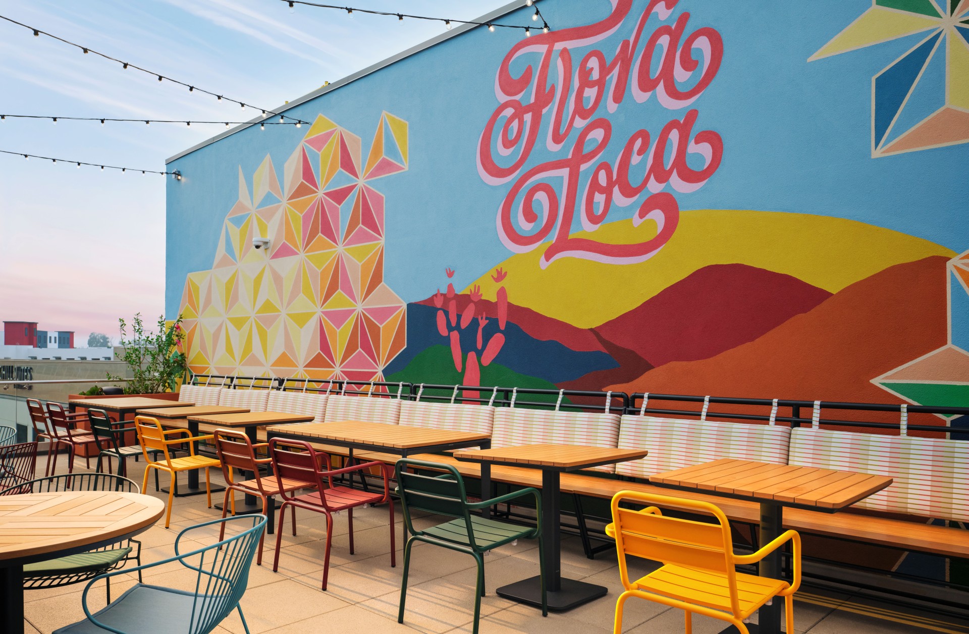 a wall with tables and chairs