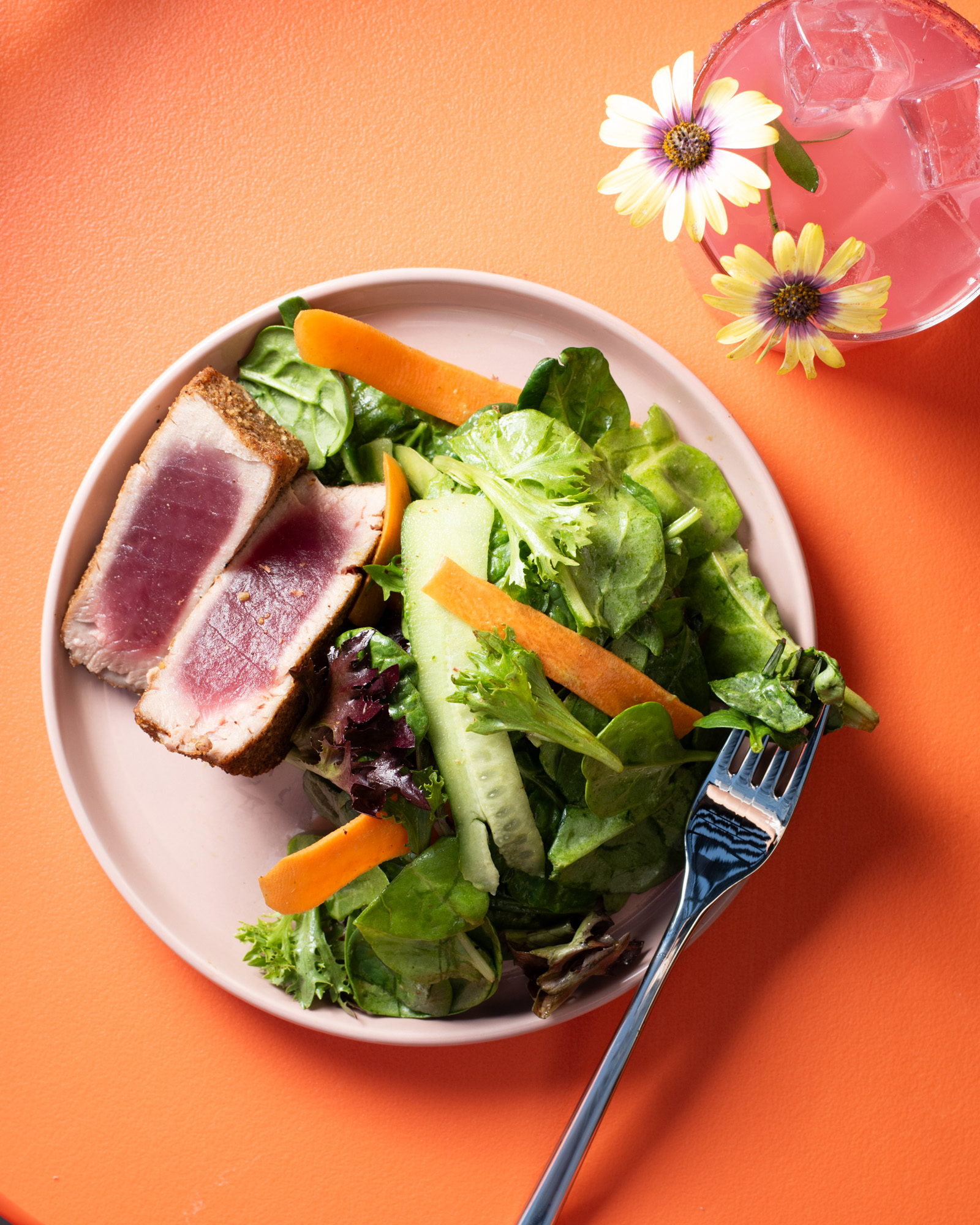 a plate of salad and meat