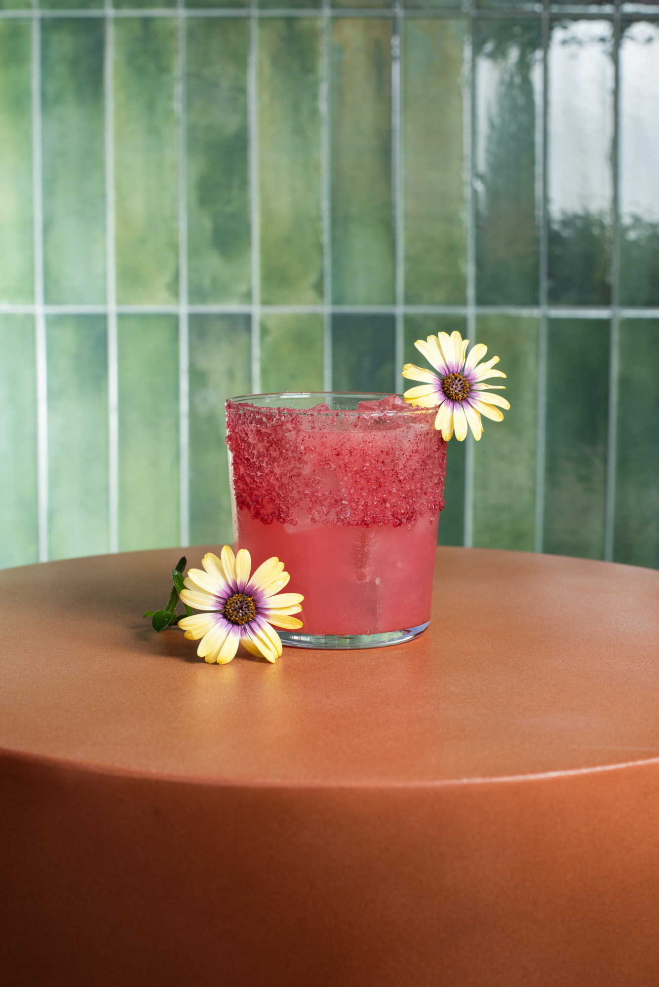 a drink with flowers on a table