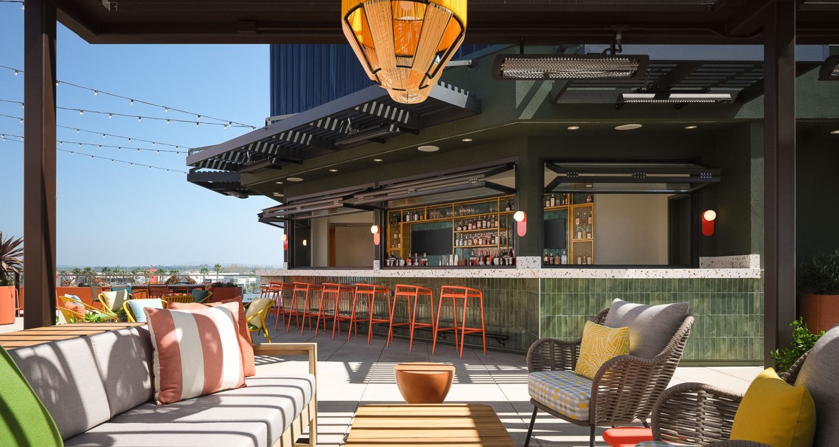 a patio with chairs and tables