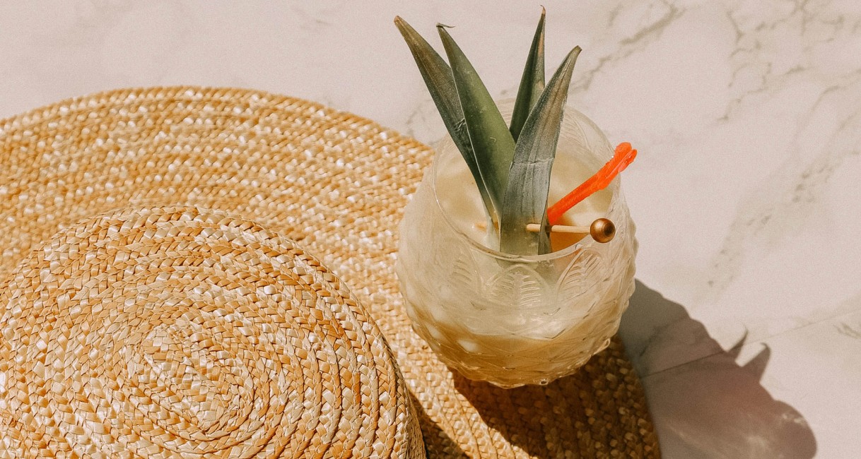 a glass with a plant in it