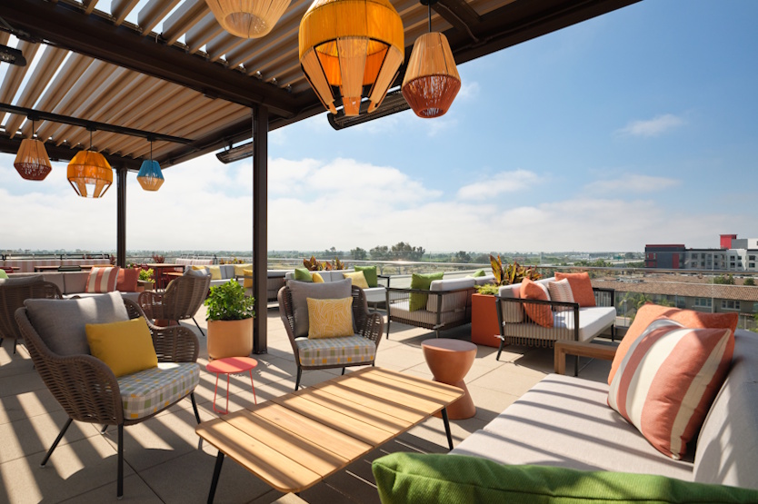 a patio with chairs and tables